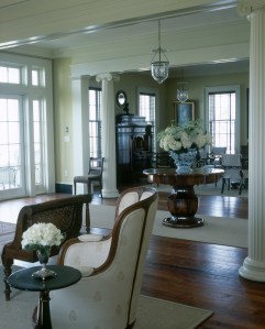 The living room's club chairs and caned chaise are new pieces chosen for their beauty as well as their durability.